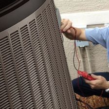 Advanced Air HVAC technician inspecting an outdoor AC unit